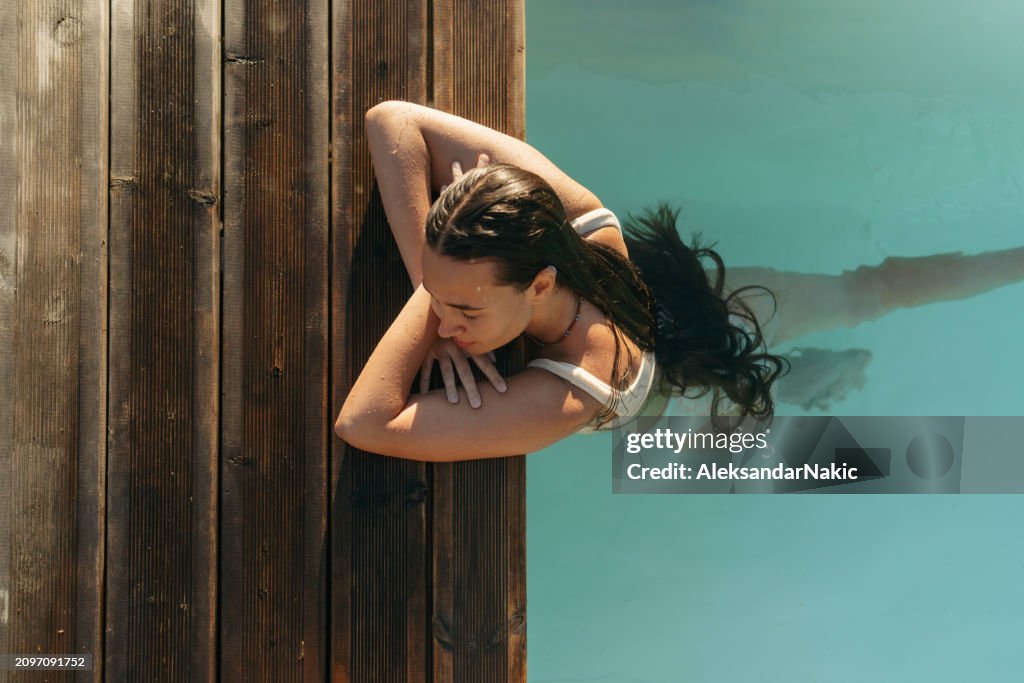 Relaxing alone in the pool