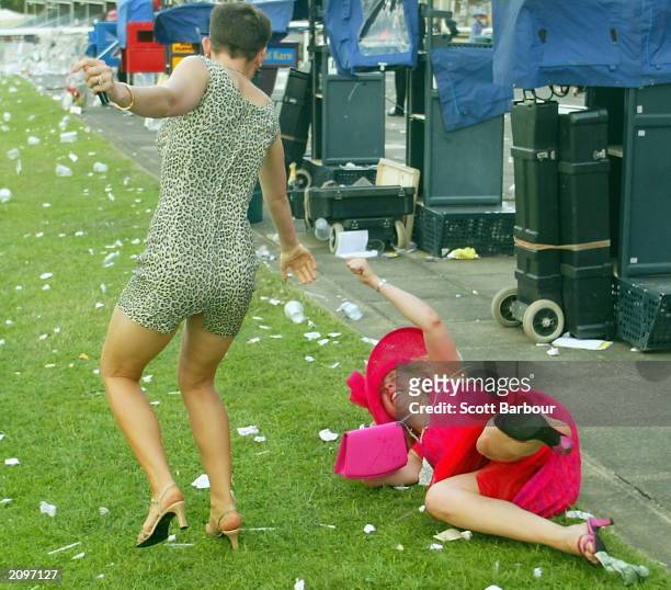 Two drunk race-goers make their way home after the last race of the third day of the Royal Ascot horse racing week June 19, 2003 in Ascot, England....