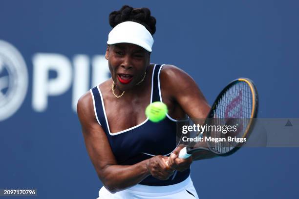 Venus Williams of the United States returns a shot to Diana Shnaider of Russia during her women's singles match during the Miami Open at Hard Rock...