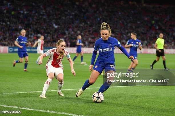 Johanna Rytting Kaneryd of Chelsea is challenged by Milicia Keijzer of Ajax during the UEFA Women's Champions League 2023/24 Quarter Final Leg One...