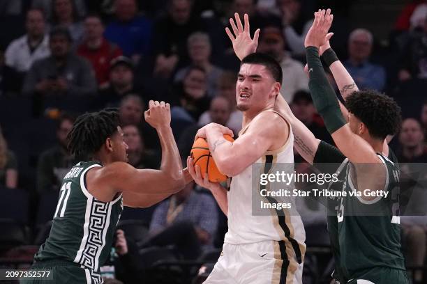 Purdue University Boilermakers center Zach Edey is pressured by three Michigan State Spartans defenders in the first half of a NCAA Big Ten Men's...