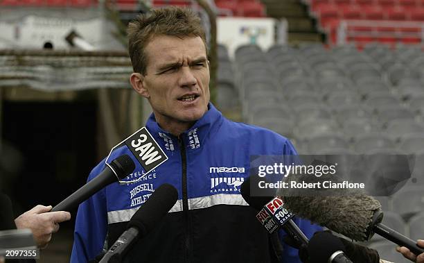 Dean Laidley coach of the Kangaroos talks to the media during the Kangaroos training session held at the Whitten Oval June 20, 2003 in Melbourne,...