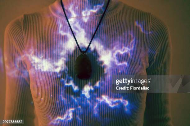 woman in ultraviolet lighting. tenderness and grace, holiday party - globe pendant light stock pictures, royalty-free photos & images