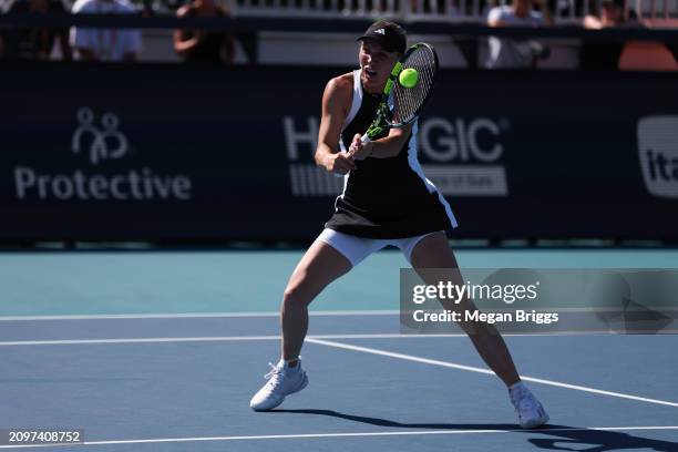 Caroline Wozniacki of Denmark returns a shot to Clara Burel of France during her women's singles match during the Miami Open at Hard Rock Stadium on...