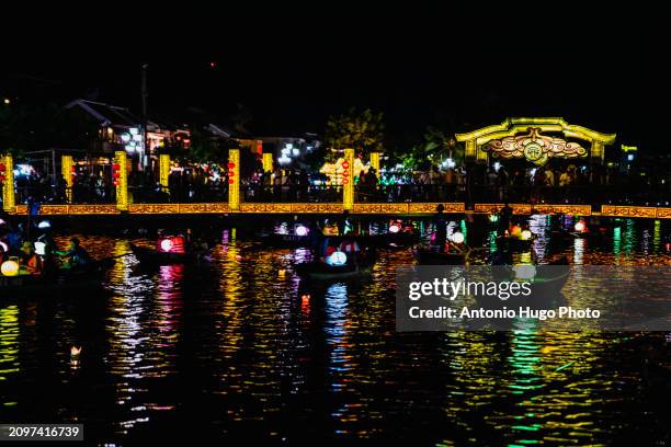 thu bon river at night in hoi an. in the background the japanese bridge - hanoi cityscape stock pictures, royalty-free photos & images