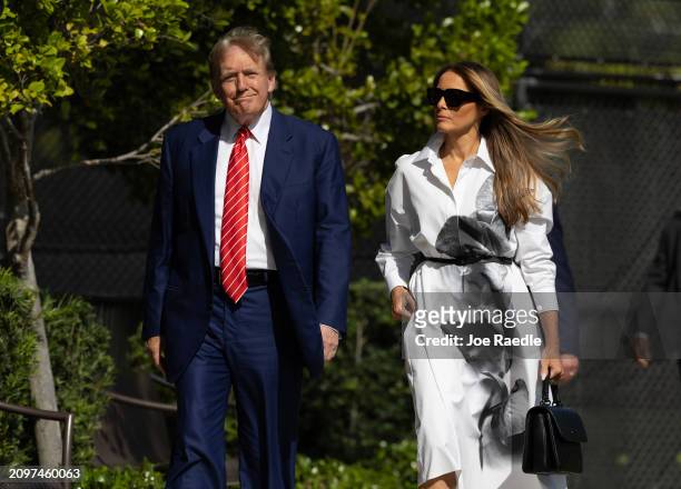Former U.S. President Donald Trump and former first lady Melania Trump walk together as they prepare to vote at a polling station setup in the Morton...