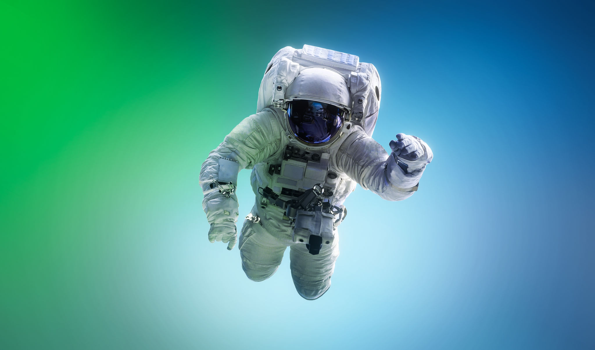 Spaceman floating in space. Astronaut on bright blue and green background. Man in space suit fly. Sci-fi wallpaper. Graphic design space concept. Mixed media Spaceman floating in space. Astronaut on bright blue and green background. Man in space suit fly. Sci-fi wallpaper. Graphic design space concept. Mixed media