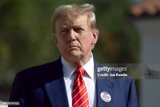 Former U.S. President Donald Trump speaks to the media after voting at a polling station setup in the Morton and Barbara Mandel Recreation Center on...