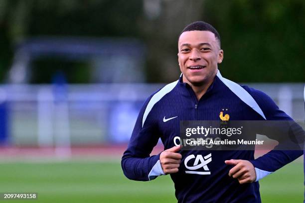 Kylian Mbappe reacts during a France training session as part of the French national team's preparation for upcoming friendly football matches at...