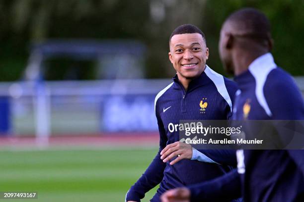 Kylian Mbappe reacts during a France training session as part of the French national team's preparation for upcoming friendly football matches at...