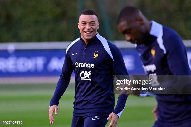 Kylian Mbappe reacts during a France training session as part of the French national team's preparation for upcoming friendly football matches at...