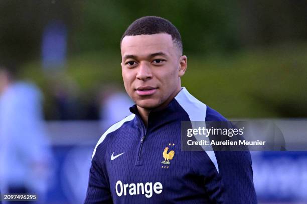 Kylian Mbappe looks on during a France training session as part of the French national team's preparation for upcoming friendly football matches at...