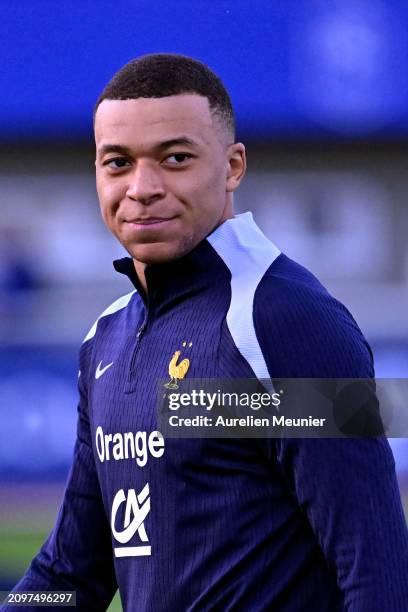 Kylian Mbappe looks on during a France training session as part of the French national team's preparation for upcoming friendly football matches at...