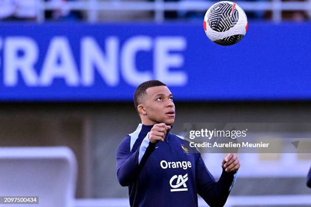 Kylian Mbappe controls the ball during a France training session as part of the French national team's preparation for upcoming friendly football...