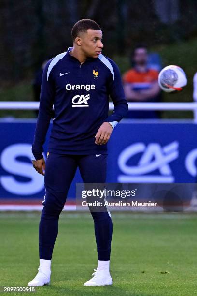 Kylian Mbappe looks on during a France training session as part of the French national team's preparation for upcoming friendly football matches at...