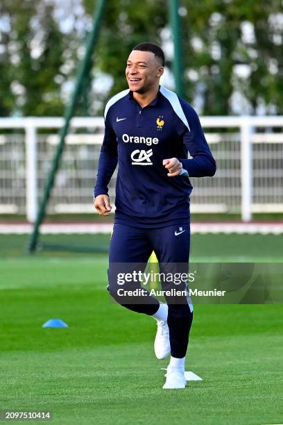 Kylian Mbappe warms up during a France training session as part of the French national team's preparation for upcoming friendly football matches at...