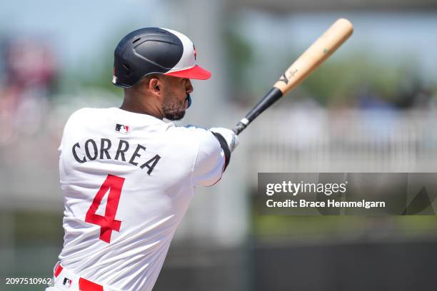 Carlos Correa of the Minnesota Twins bats during a spring training game against the Boston Red Sox on March 18, 2024 at the Lee County Sports Complex...