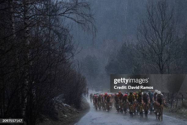 Joao Almeida of Portugal and UAE Emirates Team leads the peloton in heavy rain during the 103rd Volta Ciclista a Catalunya 2024, Stage 2 a 186.5km...