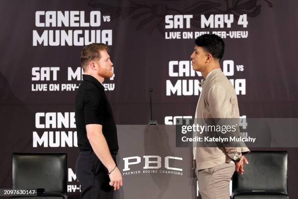 Canelo Alvarez and Jaime Munguia face off during a news conference to preview their super middleweight fight at The Beverly Hills Hotel on March 19,...