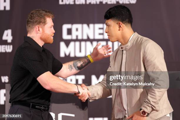 Canelo Alvarez and Jaime Munguia shake hands during a news conference to preview their super middleweight fight at The Beverly Hills Hotel on March...