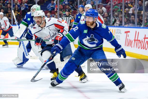 Ian Cole of the Vancouver Canucks defends against Alex Ovechkin of the Washington Capitals during the first period of their NHL game at Rogers Arena...