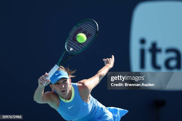 Simona Halep of Romania returns a shot to Paula Badosa of Spain during her women's singles match during the Miami Open at Hard Rock Stadium on March...