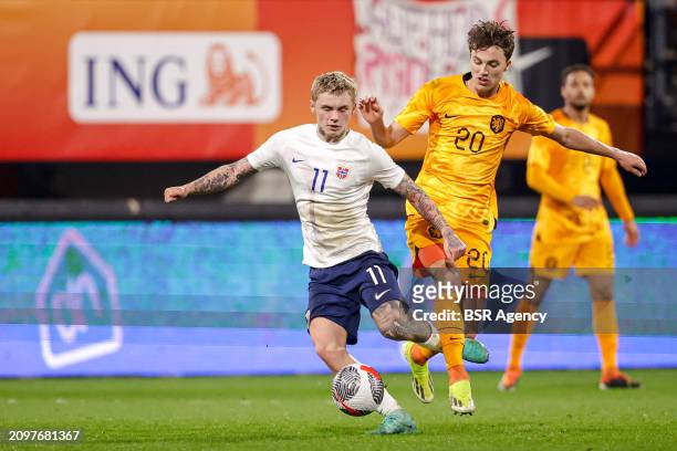 Isak Hansen-Aaroen of Norway U21 battles for possession with Youri Regeer of the Netherlands U21 during the U21 International Friendly match between...