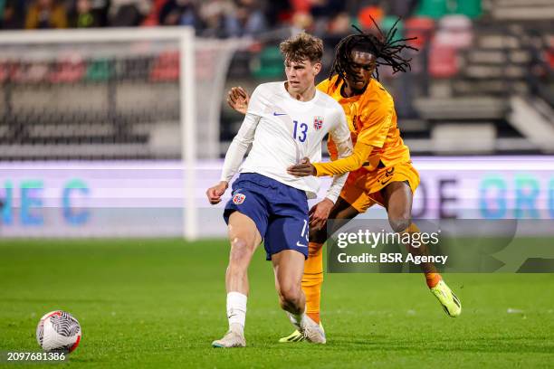 Ibrahim Cissoko of the Netherlands U21 is tackling Goalkeeper Tobias Guddal of Norway U21 during the U21 International Friendly match between...