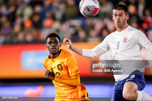 Ernest Poku of the Netherlands U21 looks onto the ball Lasse Nordas of Norway U21 during the U21 International Friendly match between Netherlands U21...