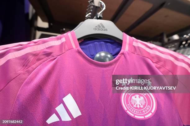 Germany's national team jerseys made by Adidas are pictured in official store on March 22, 2024 in Frankfurt am Main, western Germany ahead German...