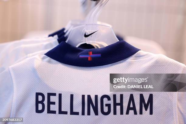 Racks of England's new Nike designed football shirt are displayed for sale in a central London store on March 22, 2024. British Prime Minister Rishi...