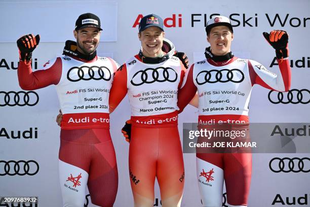 The overall-season's Super-G top three second placed Austria's Vincent Kriechmayr, first placed Switzerland's Marco Odermatt and third placed...