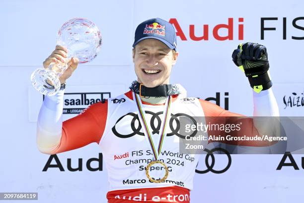 Marco Odermatt of Team Switzerland wins the globe in the overall standings during the Audi FIS Alpine Ski World Cup Finals Men's Super G on March 22,...