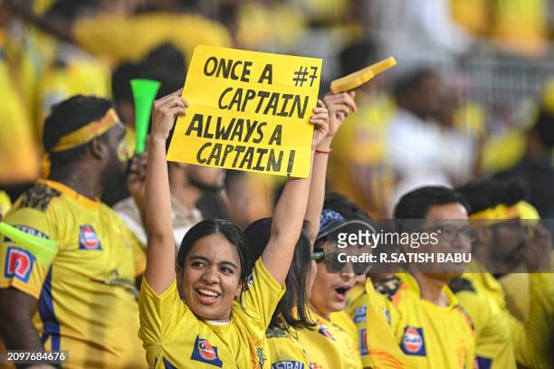 Chennai Super Kings' fans cheer before the start of the Indian Premier League Twenty20 cricket match between Chennai Super Kings and Royal...