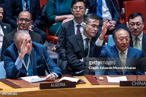 Permanent Representative of Algeria to the United Nations Amar Bendjama and China's ambassador to the United Nations, Zhang Jun, vote against a U.S....