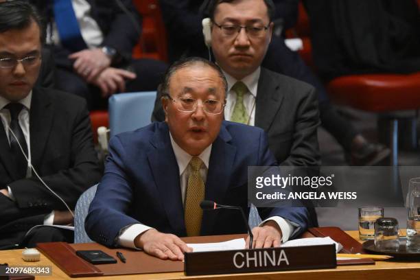 China's UN Ambassador Zhang Jun speaks during a UN Security Council vote on a Gaza ceasefire and hostage deal at UN headquarters in New York, on...