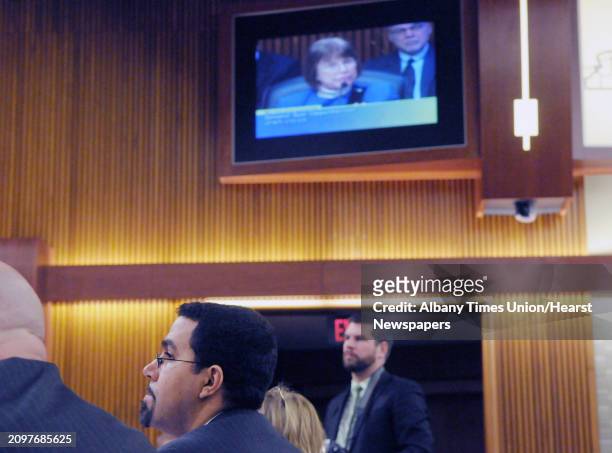 John King, Jr., the New York State commissioner of education, listens as Senator Suzi Oppenheimer, seen on the video screen, as a question of the...