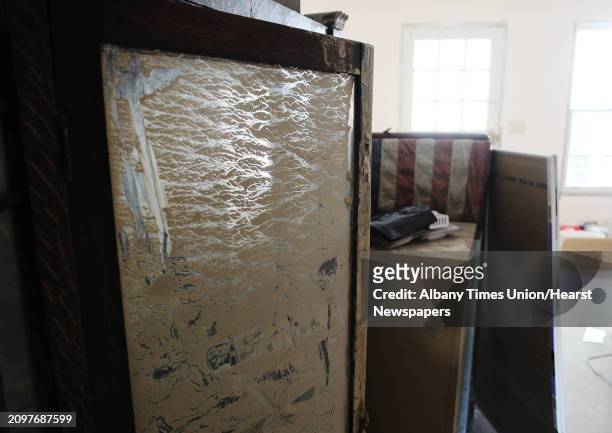 Mud is still visible on a book case in an side office of Attorney Daniel Ross seen here on Monday, June 18, 2012 in Middleburgh, NY. Ross's main...