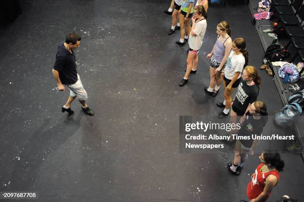 Instructor Marcus Maloney from Ireland shows students a step during a class at the Camp Rince Ceol, an Irish dance camp, on Monday, July 16, 2012 at...