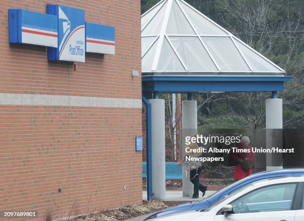 Customers with cards and packages make their way into the U.S. Post Office on Watervliet Shaker Road on Monday, Dec. 17, 2012 in Latham, NY. The...