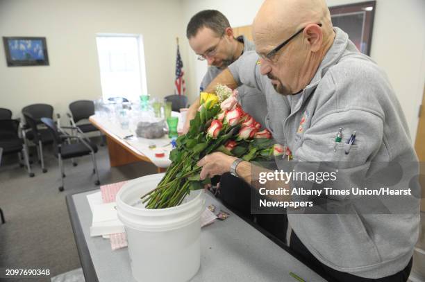 George Garney, foreground, chief of department for the General Schuyler Emergency Squad and Jamie Barton, chief operating officer, start to create...