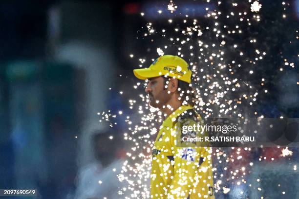 Chennai Super Kings' MS Dhoni enters the field during the Indian Premier League Twenty20 cricket match between Chennai Super Kings and Royal...