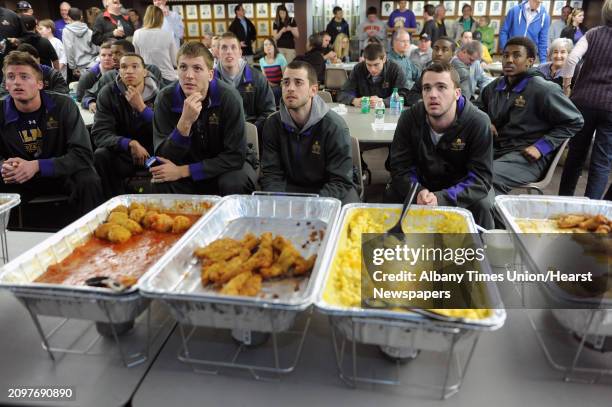 University at Albany men's basketball players, from left to right, Dave Wiegmann, Gary Johnson, Blake Metcalf, Jacob Lati, Peter Hooley and Reece...