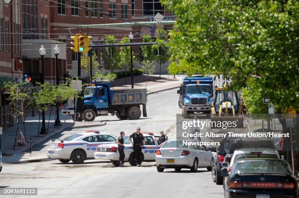 Albany Police block New Scotland Ave. To traffic as crews work to repair a hole in the street at the intersection of Myrtle Ave. And New Scotland...