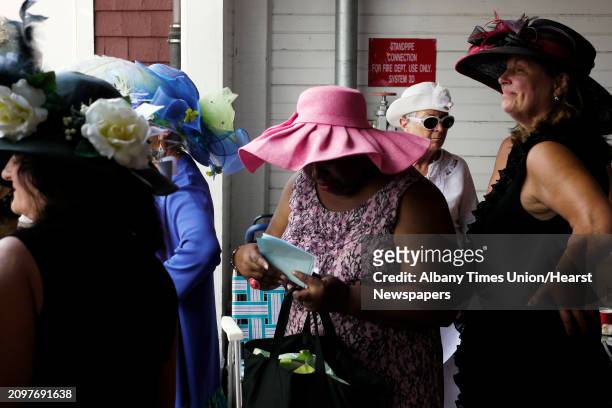 Women in the Fashionably Saratoga category line up for judging during the Hats off to Saratoga festival at the Saratoga Race Course on Sunday, July...