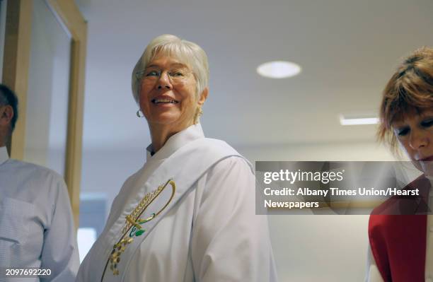 Mary Theresa Streck waits for the procession to begin at the start of the Liturgy of Ordination celebrated by the Association of Roman Catholic Women...