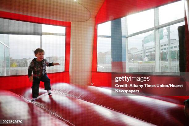 Vincent Peterman plays inside a bounce house at the 'Live Life Local' Indoor Farmer's Market at the Times Union Center on Sunday, Nov. 3, 2013 in...