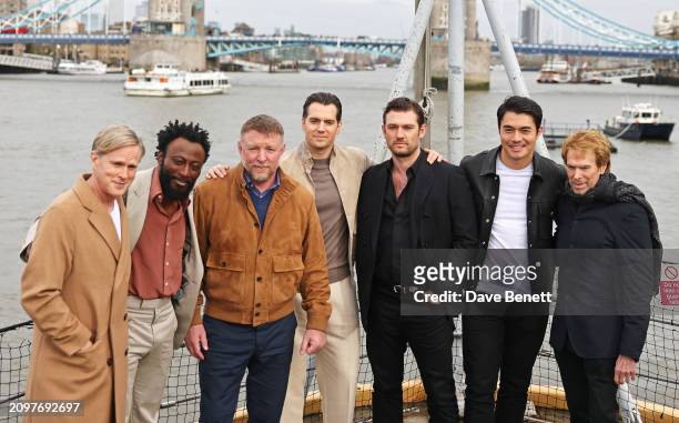 Cary Elwes, Babs Olusanmokun, Guy Ritchie, Henry Cavill, Alex Pettyfer, Henry Golding and Jerry Bruckheimer attend the London photocall for "The...