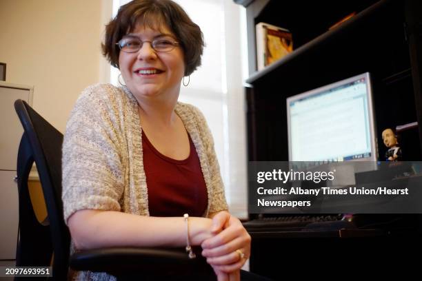 Nicole Henderson, a freelance writer, poses for a photograph at her office set up inside her home on Thrusday, Jan. 9, 2014 in Castleton, NY.