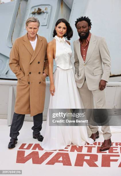 Cary Elwes, Eiza Gonzalez and Babs Olusanmokun attend the London photocall for "The Ministry Of Ungentlemanly Warfare" at HMS Belfast on March 22,...